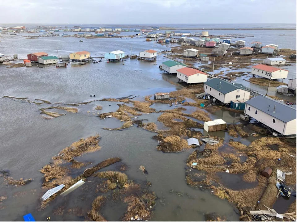 A town with homes surrounded by water.